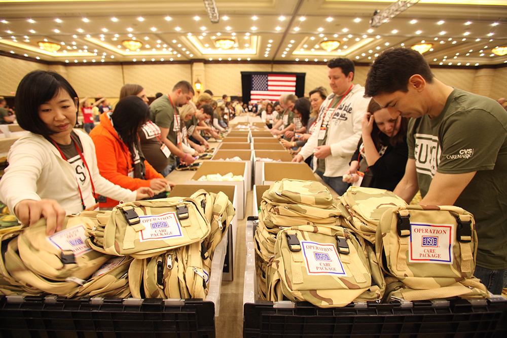 CVS Health employees prepare backpacks for a nonprofit organization