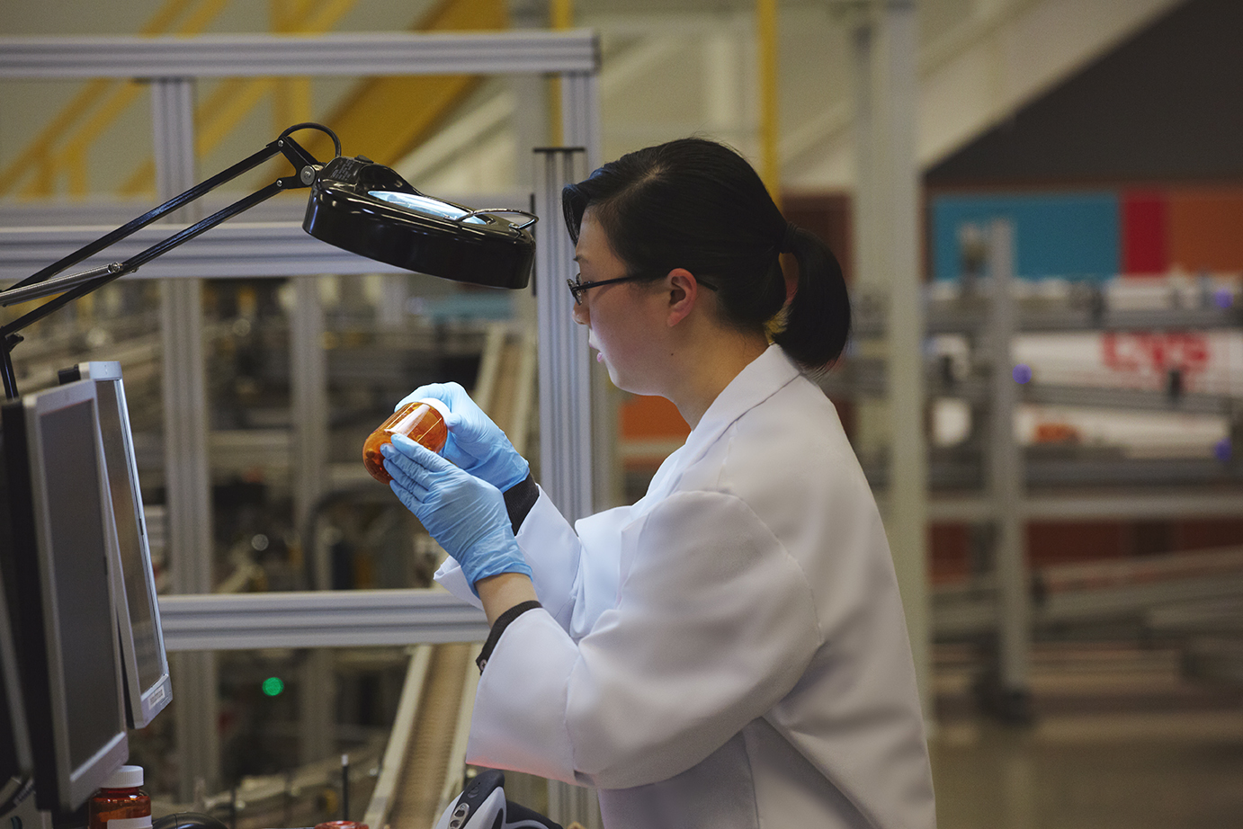 Pharmacist filling prescription in CVS Caremark mail service